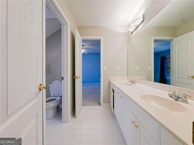 3195 Vickery Dr NE, Marietta, GA 30066 - full bath featuring tile patterned floors, double vanity, a sink, and toilet