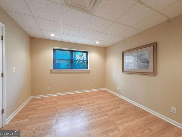 3195 Vickery Dr NE, Marietta, GA 30066 - spare room with baseboards, recessed lighting, a drop ceiling, and wood finished floors