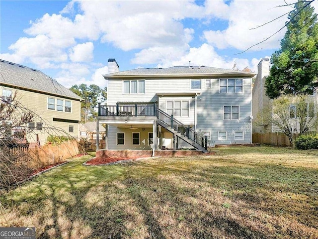 3195 Vickery Dr NE, Marietta, GA 30066 - back of house featuring a wooden deck, a patio area, fence, stairs, and a chimney