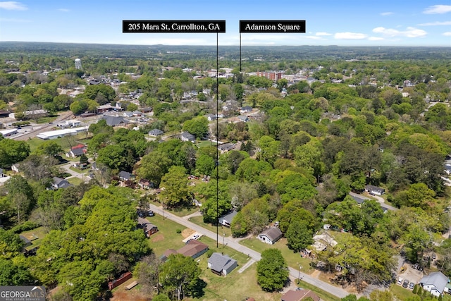 aerial view featuring a wooded view