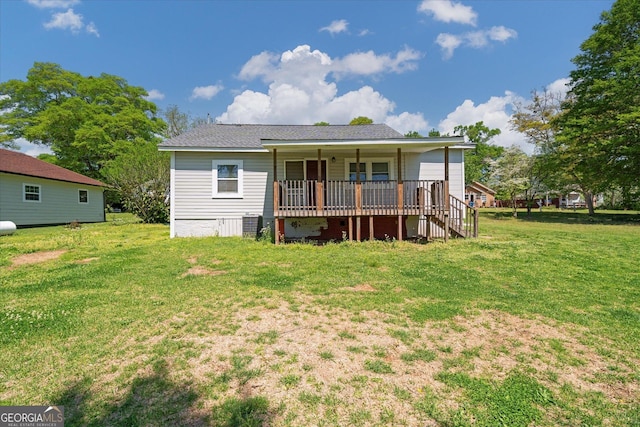 back of property with a yard