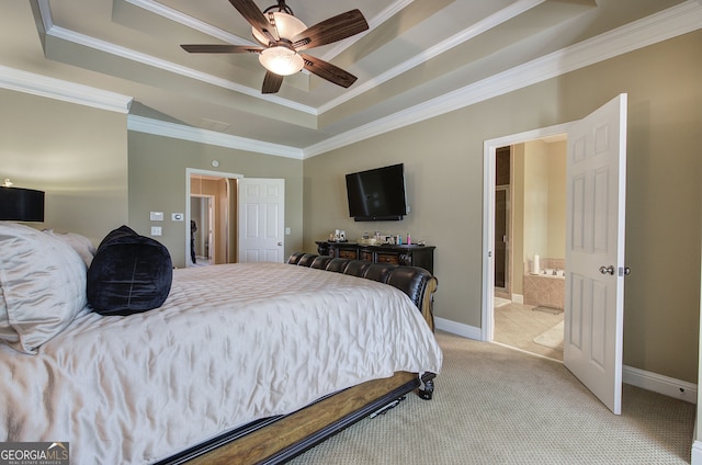 bedroom with crown molding, a tray ceiling, baseboards, and light colored carpet