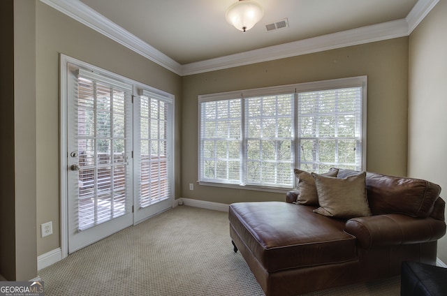 living area with carpet flooring, visible vents, baseboards, and crown molding