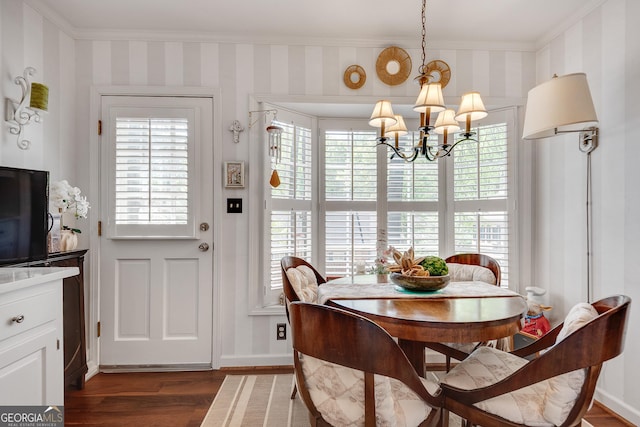 1826 Bedfordshire Ct, Decatur, GA 30033 - dining space with ornamental molding, dark wood-style floors, a chandelier, wallpapered walls, and baseboards