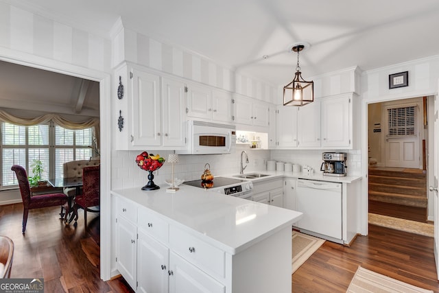 1826 Bedfordshire Ct, Decatur, GA 30033 - kitchen featuring white appliances, a sink, crown molding, decorative backsplash, and a peninsula