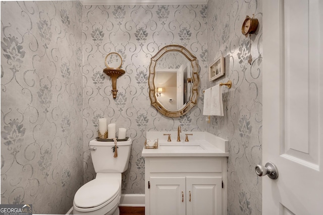1826 Bedfordshire Ct, Decatur, GA 30033 - bathroom featuring vanity, toilet, wallpapered walls, and baseboards