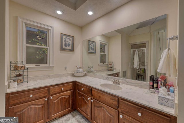 full bath with vanity, recessed lighting, and a shower