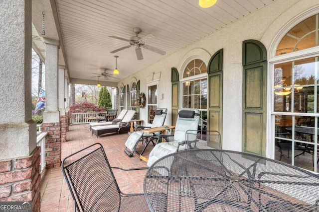 view of patio / terrace with a ceiling fan and outdoor dining space