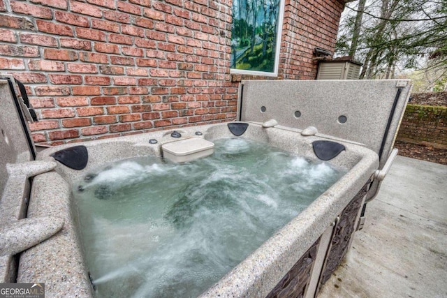 exterior view of brick siding and a jacuzzi