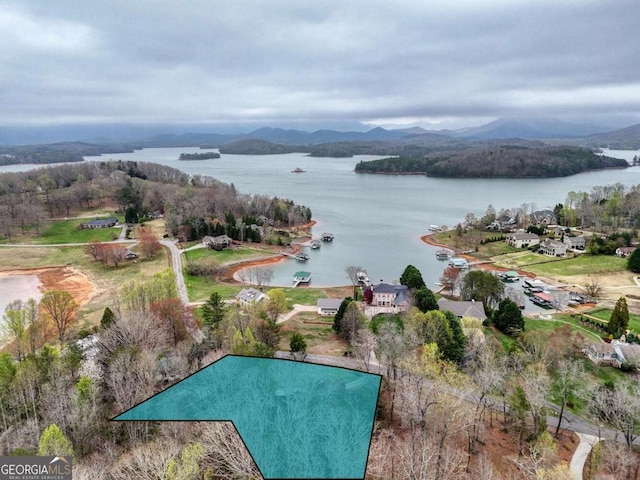 drone / aerial view of a water and mountain view