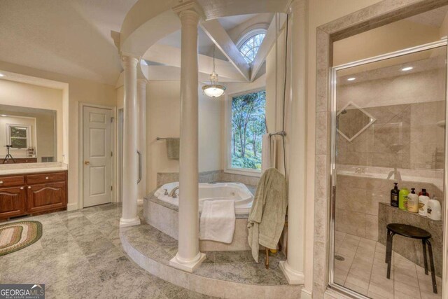 1891 Cedar Cliff Rd, Hiawassee, GA 30546 - full bathroom featuring decorative columns, a stall shower, vanity, and a bath