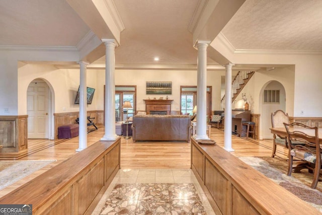 1891 Cedar Cliff Rd, Hiawassee, GA 30546 - living area featuring crown molding, a wainscoted wall, and a fireplace