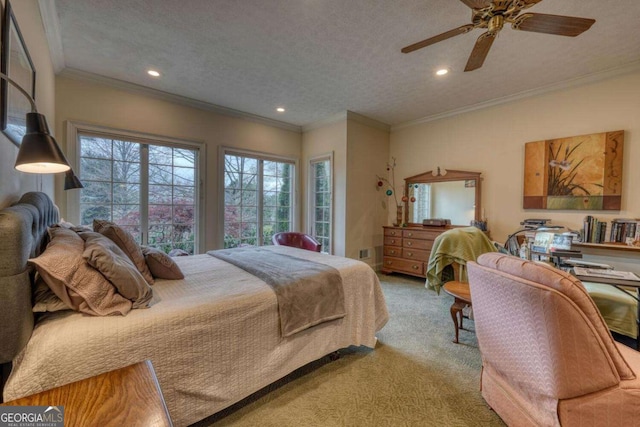 carpeted bedroom with recessed lighting, a textured ceiling, a ceiling fan, and ornamental molding