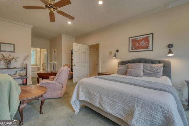 carpeted bedroom featuring recessed lighting, crown molding, ensuite bathroom, and ceiling fan