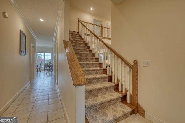 staircase with crown molding, baseboards, tile patterned floors, and recessed lighting