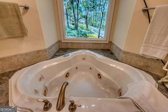 bathroom with a jetted tub