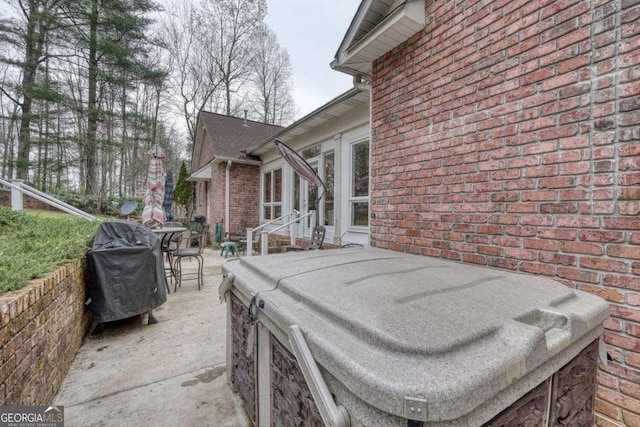 view of patio featuring a grill and outdoor dining area