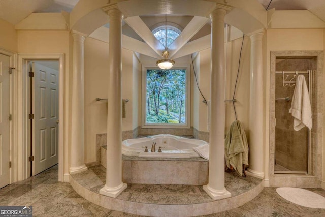 full bath featuring a bath, a shower stall, decorative columns, and vaulted ceiling
