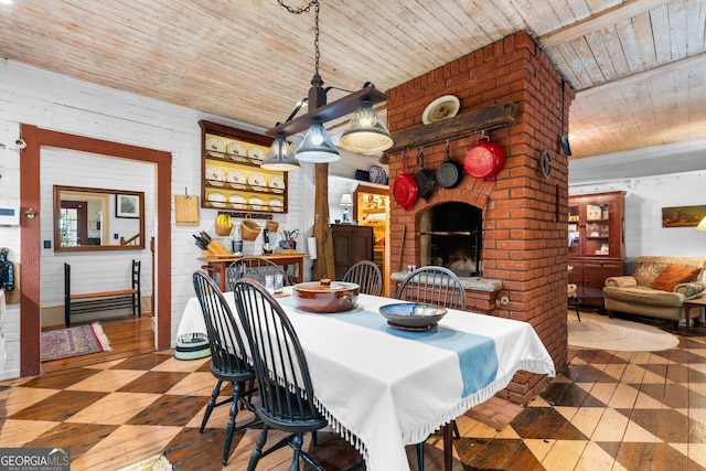 218 Barry St, Decatur, GA 30030 - dining room with tile patterned floors, a brick fireplace, and wood ceiling