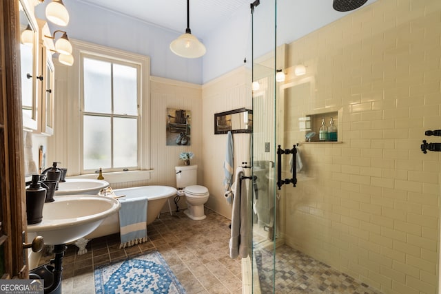 218 Barry St, Decatur, GA 30030 - bathroom featuring a shower stall, a freestanding bath, a sink, and toilet