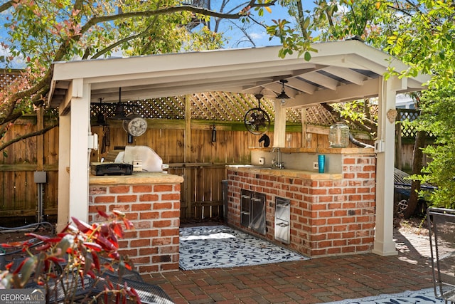 218 Barry St, Decatur, GA 30030 - view of patio with an outdoor kitchen and fence