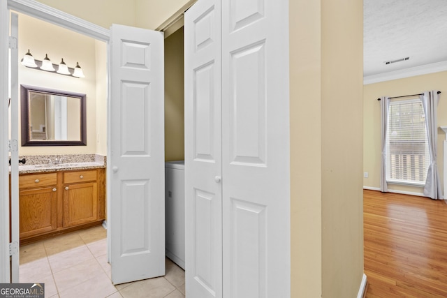 5213 Pinnacle Point Cts, Norcross, GA 30071 - bathroom with vanity, ornamental molding, visible vents, and tile patterned flooring