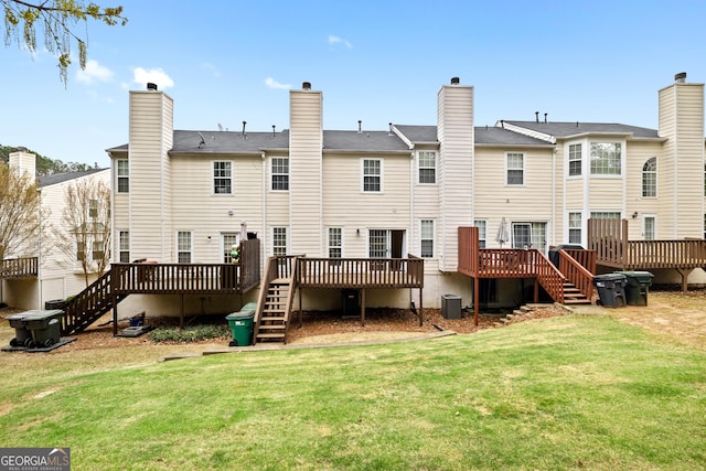 5213 Pinnacle Point Cts, Norcross, GA 30071 - rear view of property featuring central air condition unit, a lawn, a deck, and stairs