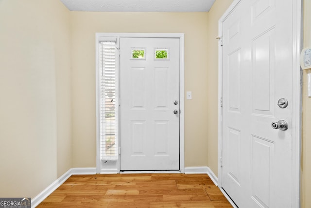 5213 Pinnacle Point Cts, Norcross, GA 30071 - foyer entrance featuring light wood-style flooring and baseboards