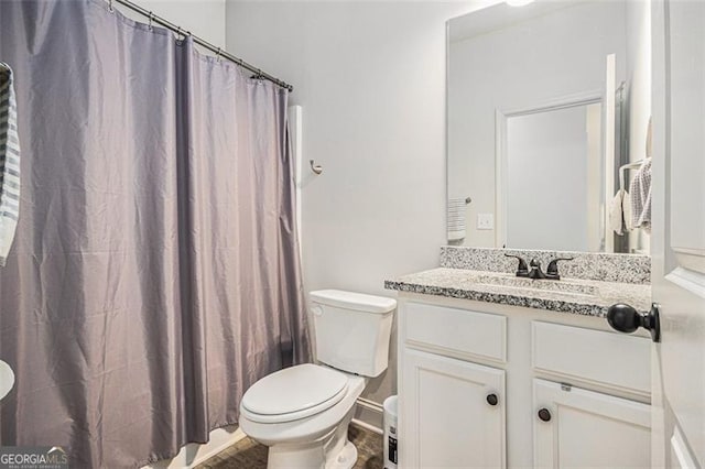 1195 Awenasa Dr, Villa Rica, GA 30180 - bathroom featuring vanity, wood finished floors, toilet, and curtained shower