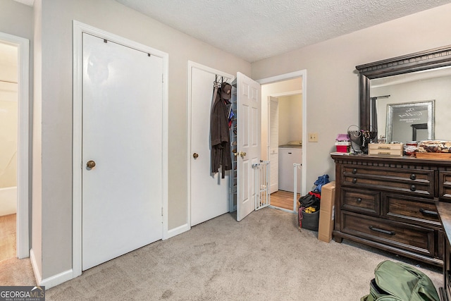 carpeted bedroom with a textured ceiling