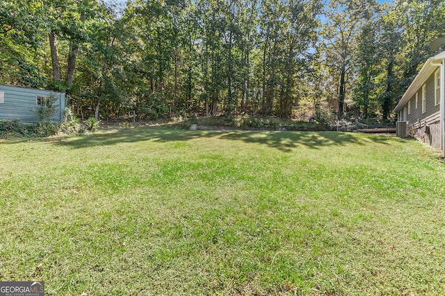 view of yard featuring central AC