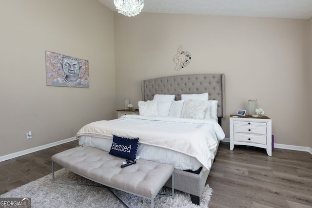 101 Javay Ct, Villa Rica, GA 30180 - bedroom featuring wood finished floors and a chandelier