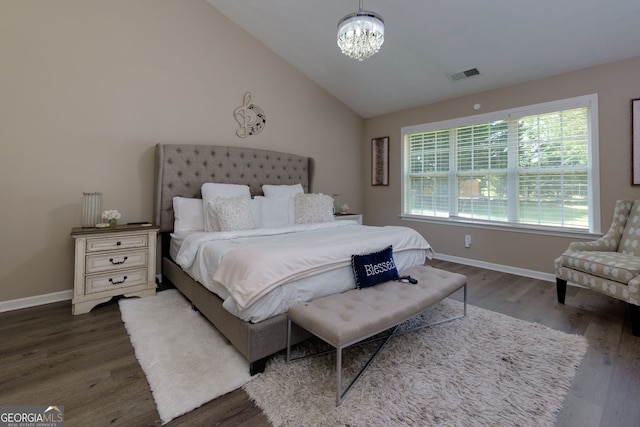 101 Javay Ct, Villa Rica, GA 30180 - bedroom featuring wood finished floors, a chandelier, and vaulted ceiling