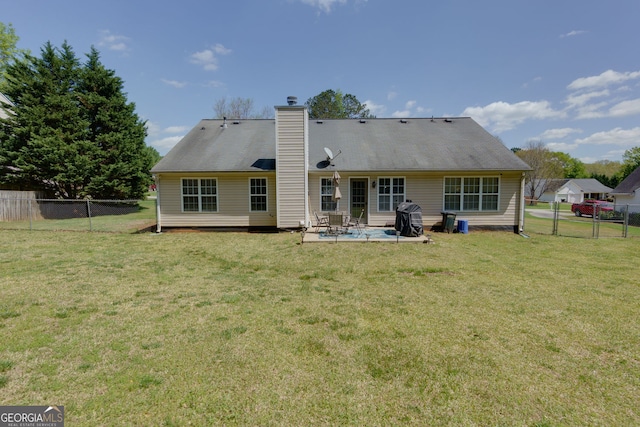 101 Javay Ct, Villa Rica, GA 30180 - rear view of house featuring a patio, a fenced backyard, and a chimney