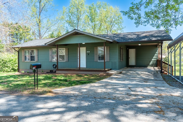 140 Goldust Ave, Clarkesville, GA 30523 - ranch-style home with concrete driveway, a porch, roof with shingles, and a carport