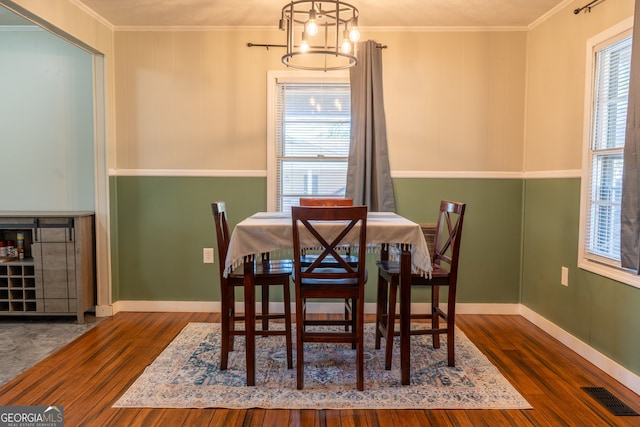 140 Goldust Ave, Clarkesville, GA 30523 - dining area featuring wood finished floors, crown molding, and a chandelier