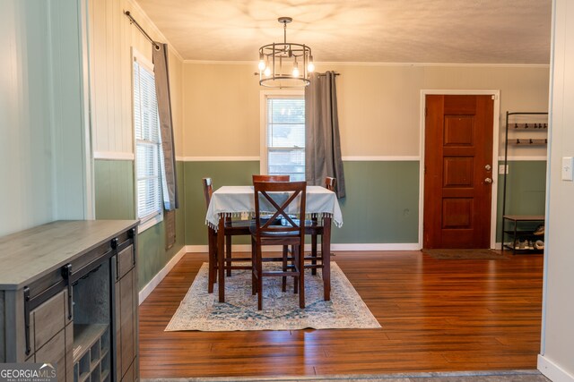 140 Goldust Ave, Clarkesville, GA 30523 - dining area featuring dark wood-style flooring, plenty of natural light, a chandelier, and crown molding