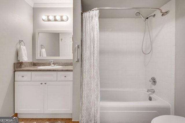bathroom featuring toilet, shower / bath combo, vanity, and crown molding
