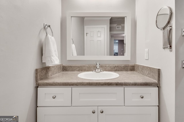 bathroom featuring visible vents and vanity