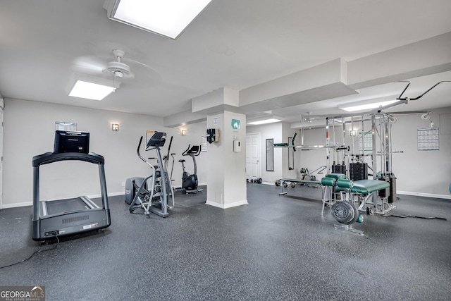gym featuring baseboards