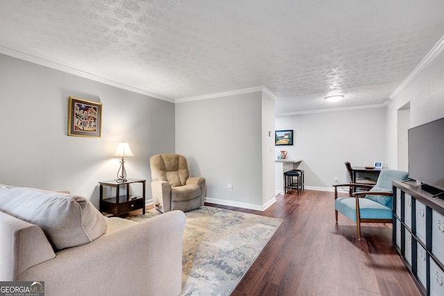 living area featuring a textured ceiling, baseboards, ornamental molding, and dark wood finished floors