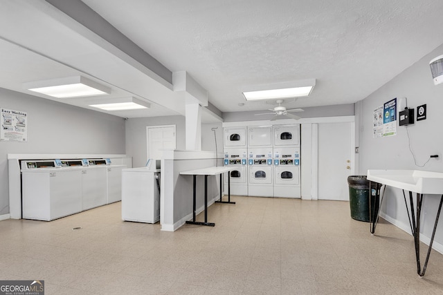 interior space featuring stacked washer / dryer, separate washer and dryer, baseboards, and light floors