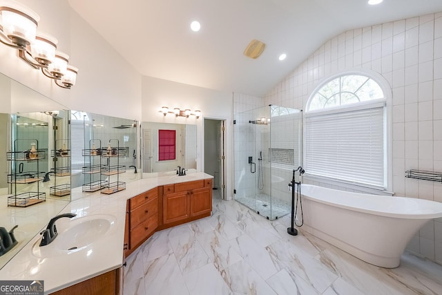 full bathroom featuring a soaking tub, a shower stall, recessed lighting, marble finish floor, and lofted ceiling