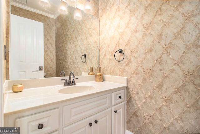 bathroom with vanity and crown molding