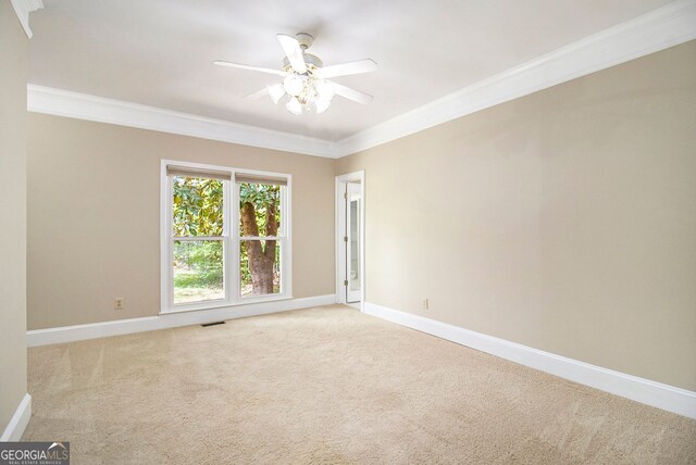 110 Kylemore Pass, Tyrone, GA 30290 - empty room featuring crown molding, carpet, ceiling fan, and baseboards
