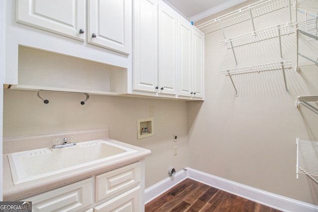 laundry area featuring cabinet space, baseboards, washer hookup, dark wood-style floors, and electric dryer hookup