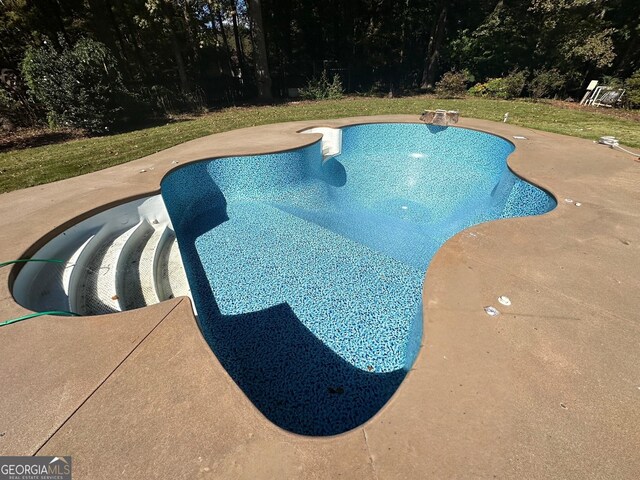 110 Kylemore Pass, Tyrone, GA 30290 - outdoor pool with a patio area and view of scattered trees