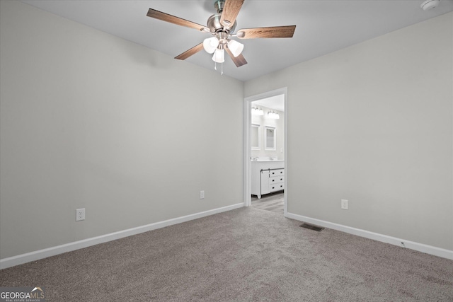 313 Ellenwood Dr, Bowdon, GA 30108 - carpeted empty room with baseboards, ceiling fan, and a smoke detector