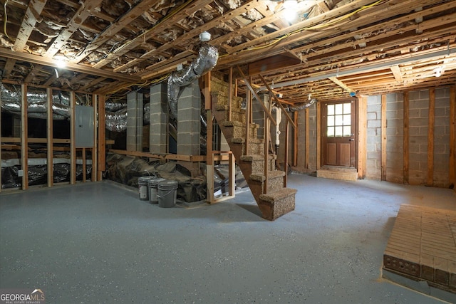 313 Ellenwood Dr, Bowdon, GA 30108 - basement featuring electric panel and stairs