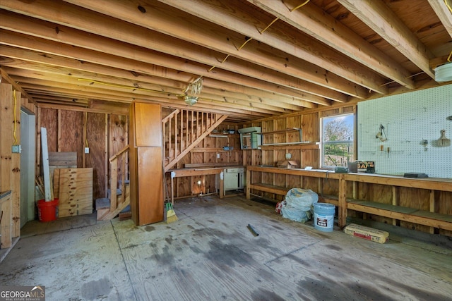 313 Ellenwood Dr, Bowdon, GA 30108 - miscellaneous room featuring a workshop area and stairs